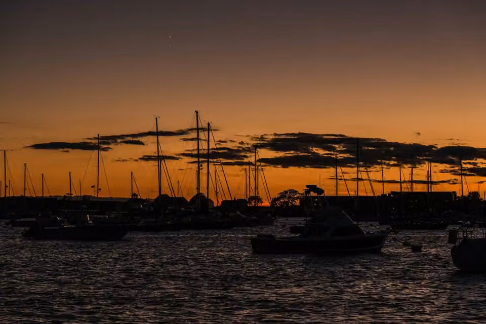 Newport Harbor · Boats on the water at dusk