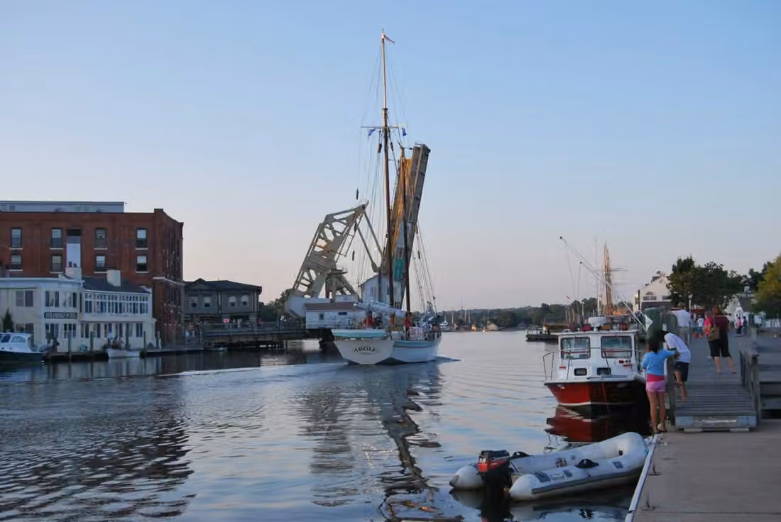 Mystic River · A sailboat passes through the open drawbridge