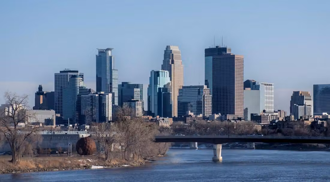Looking south to Minneapolis · The Mississippi River and city skyline